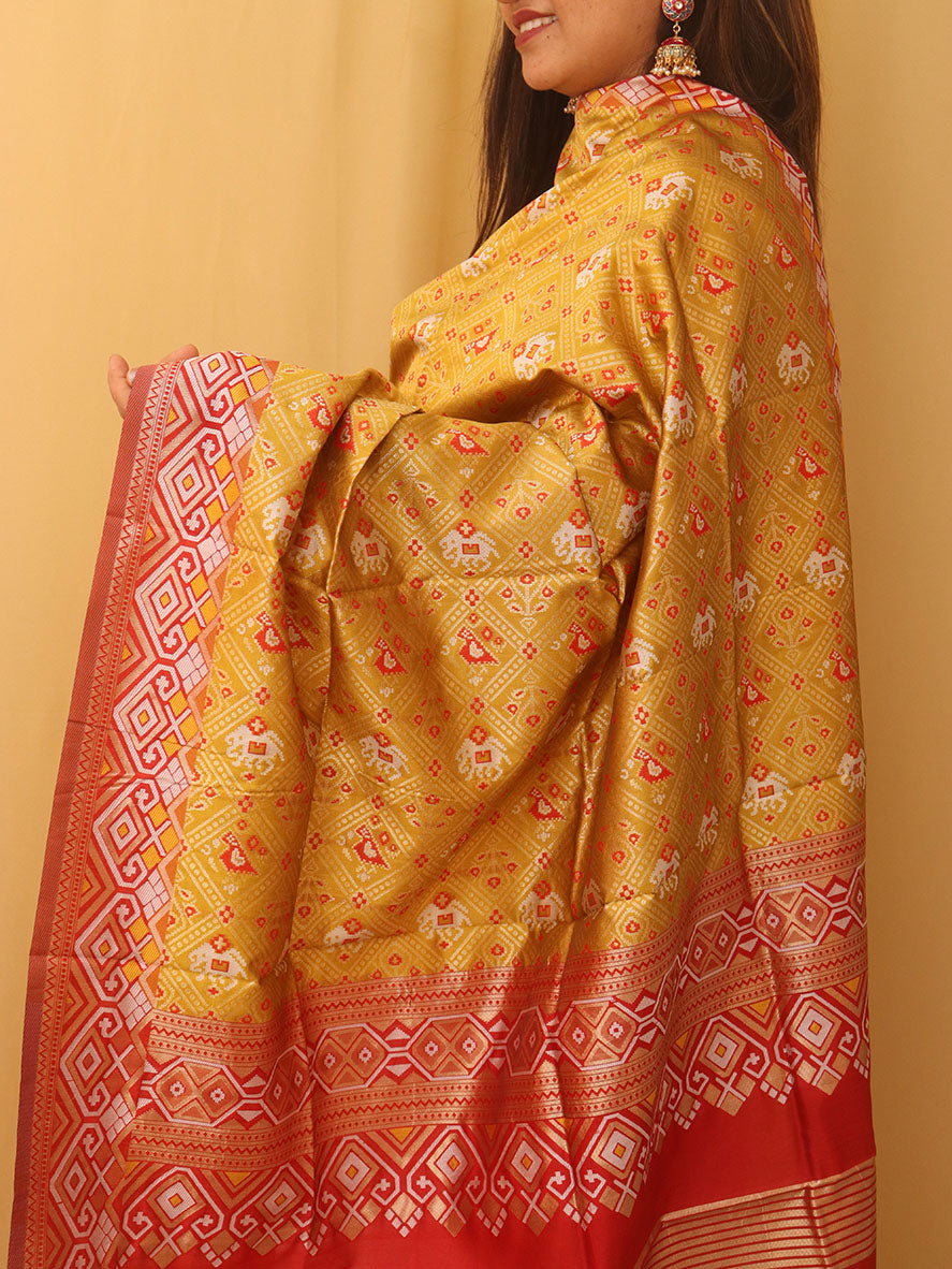 Vibrant Yellow Patola Silk Dupatta with Handcrafted Tassel - Luxurion World