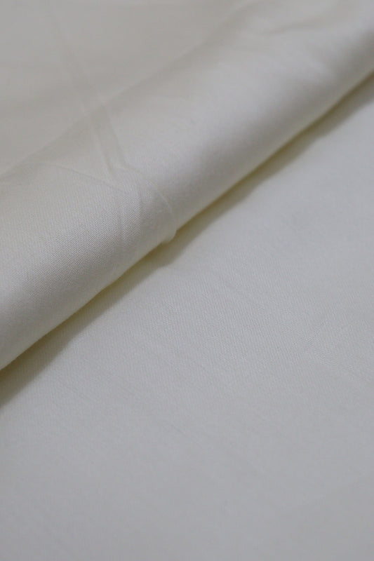 Pure Comfort: Off White Cotton Fabric for Versatile Apparel