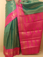 Stunning Green & Pink Kanjeevaram Silk Saree: A Perfect Blend of Elegance and Vibrancy - Luxurion World