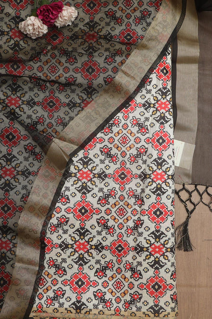 Elegant Off White Patola Design Tussar Silk Suit With Black Banarasi Tissue Dupatta - Luxurion World