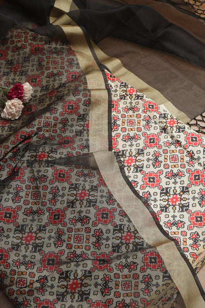 Elegant Off White Patola Design Tussar Silk Suit With Black Banarasi Tissue Dupatta - Luxurion World