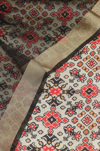 Elegant Off White Patola Design Tussar Silk Suit With Black Banarasi Tissue Dupatta - Luxurion World