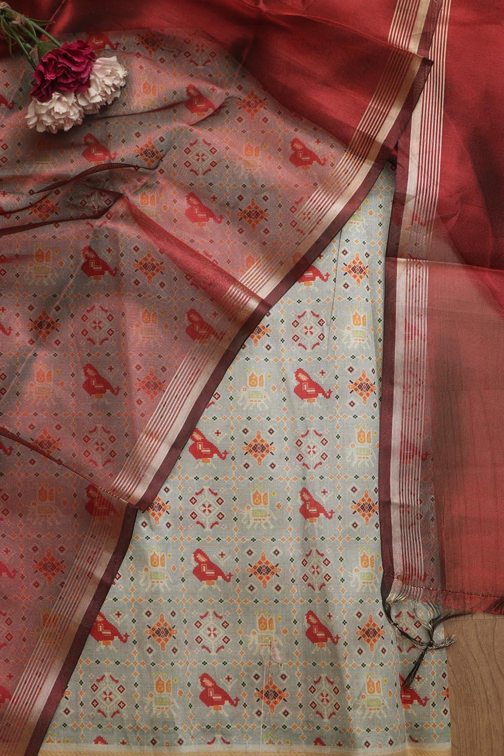Elegant Grey Patola Design Tussar Silk Suit With Maroon Banarasi Tissue Dupatta - Luxurion World