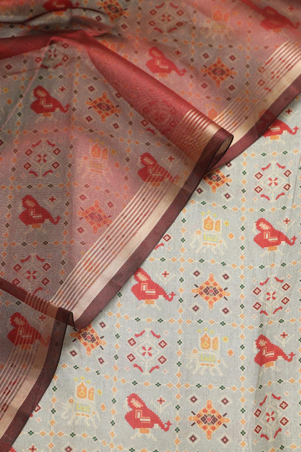 Elegant Grey Patola Design Tussar Silk Suit With Maroon Banarasi Tissue Dupatta - Luxurion World