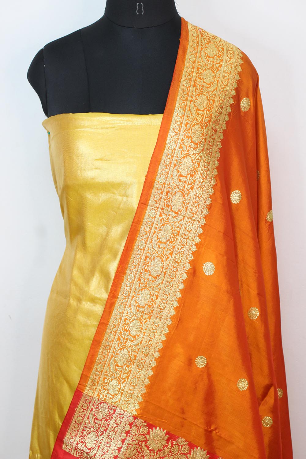 Yellow Plain Soft Tissue Katan Silk Suit With Orange Handloom Banarasi Pure Katan Silk Dupatta - Luxurion World