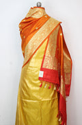 Yellow Plain Soft Tissue Katan Silk Suit With Orange Handloom Banarasi Pure Katan Silk Dupatta - Luxurion World