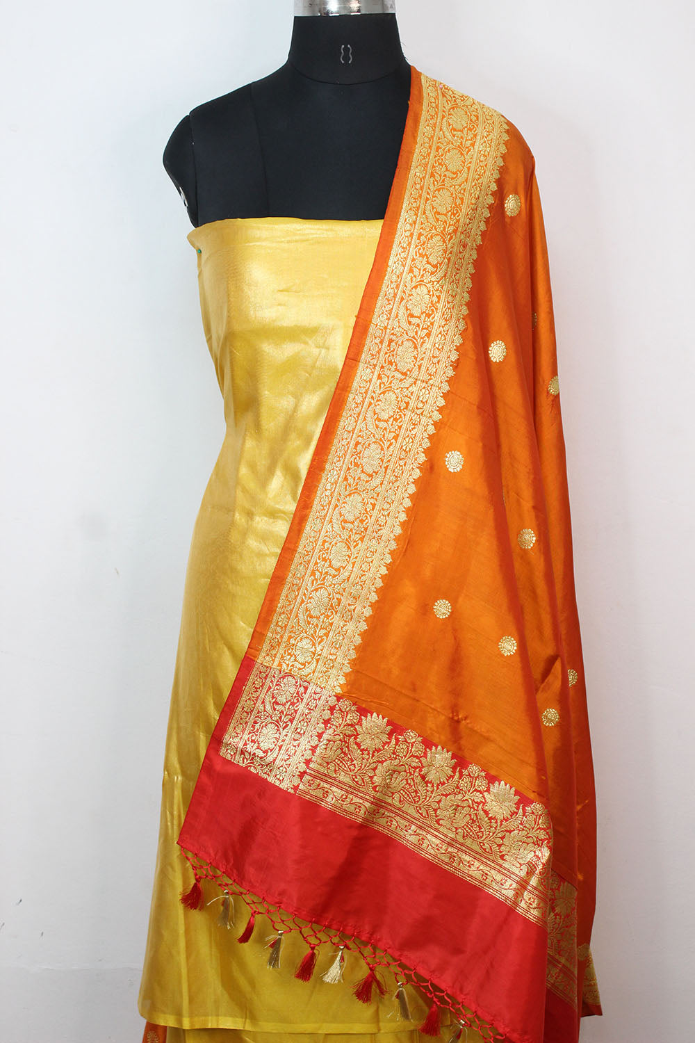Yellow Plain Soft Tissue Katan Silk Suit With Orange Handloom Banarasi Pure Katan Silk Dupatta - Luxurion World
