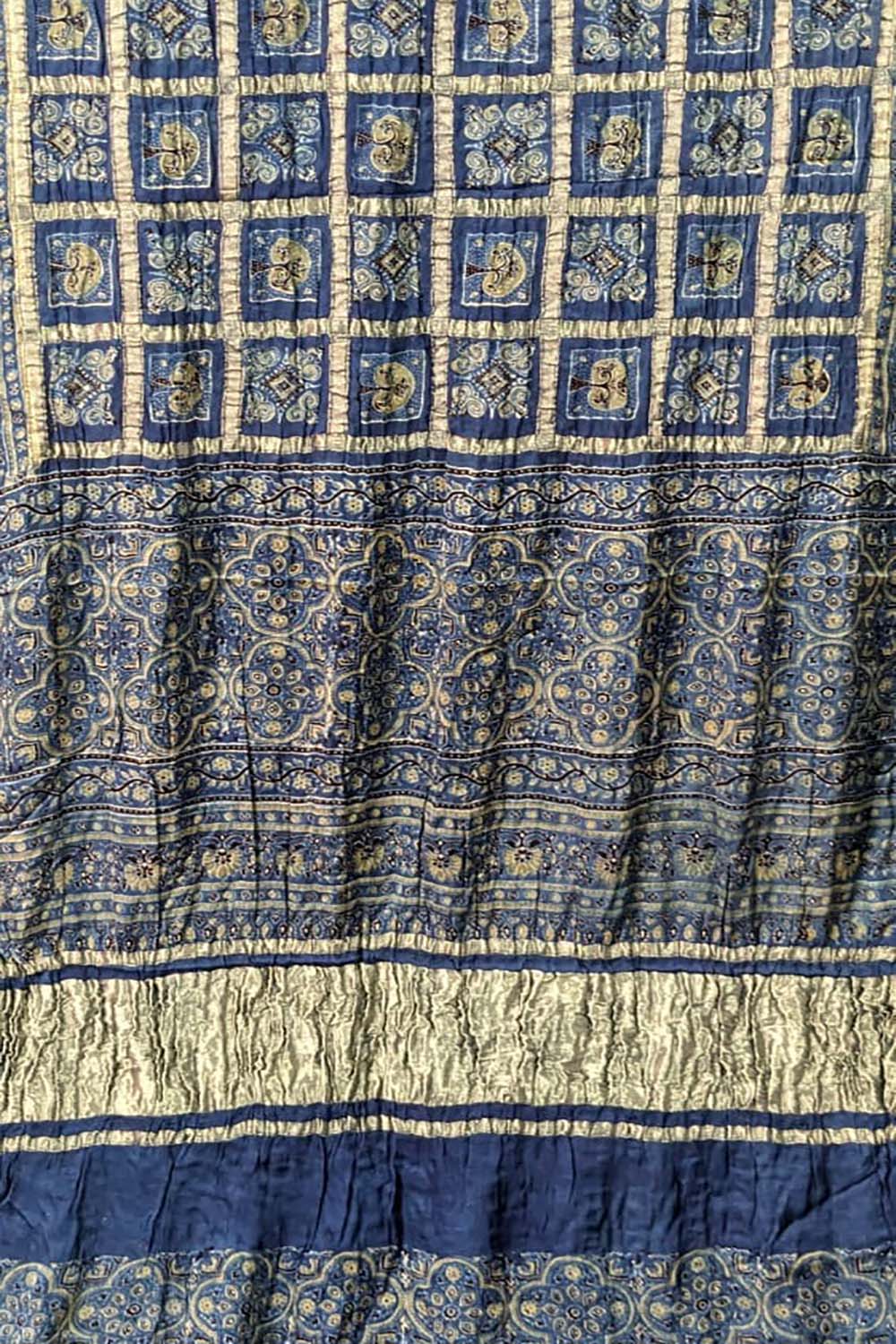 Get enchanted by our hand block printed blue Ajrakh modal silk saree - Luxurion World