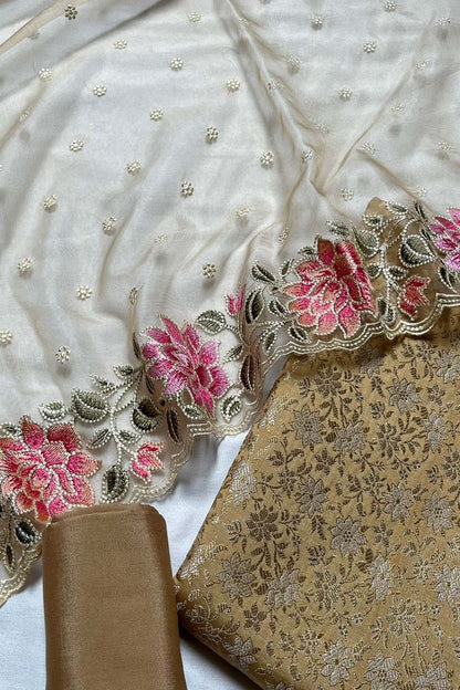 Cream Banarasi Katan Silk Three Piece Unstitched Suit Set With Embroidered Organza Dupatta